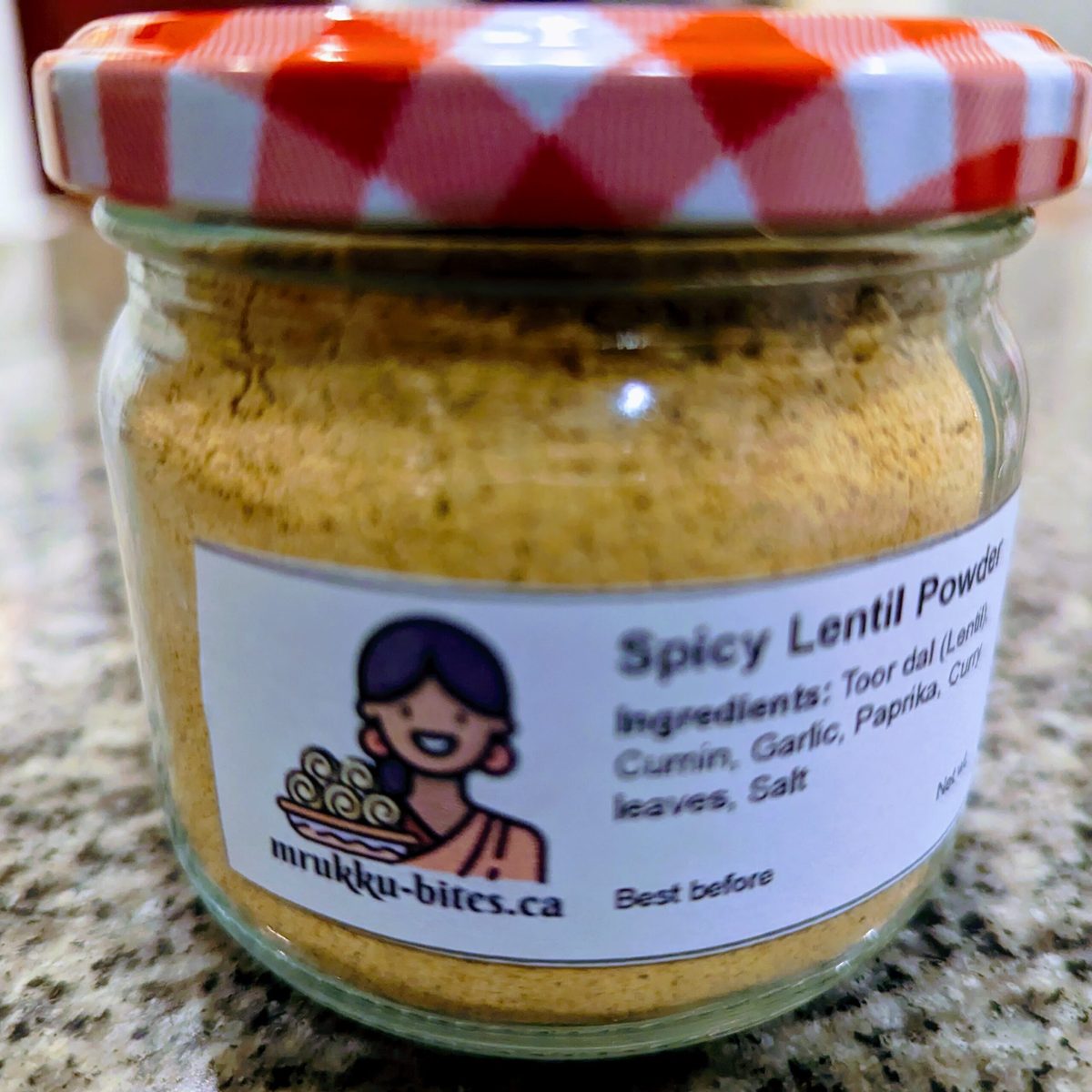 A jar of Mrukku Bites Spicy Lentil Powder, original flavour